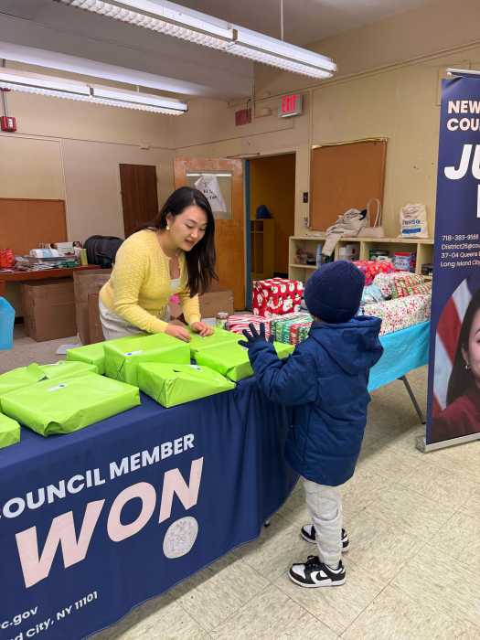 Won distributes toys at Woodside Houses. Photo courtesy of office of Council Member Julie Won.