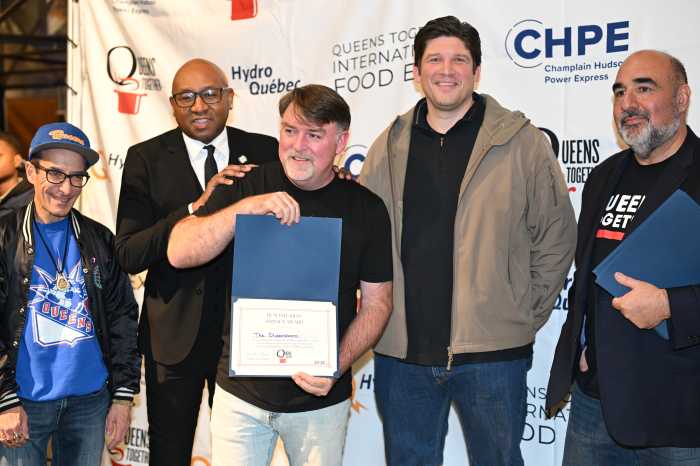 Michael Fuquay receives a humanitarian services award at Monday's expo. Photo by Ramy Mahmoud.