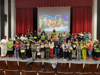 Council Member Sandra Ung with P.S. 122Q students at a recent holiday giveaway. Photo via CM Sandra Ung Twitter.
