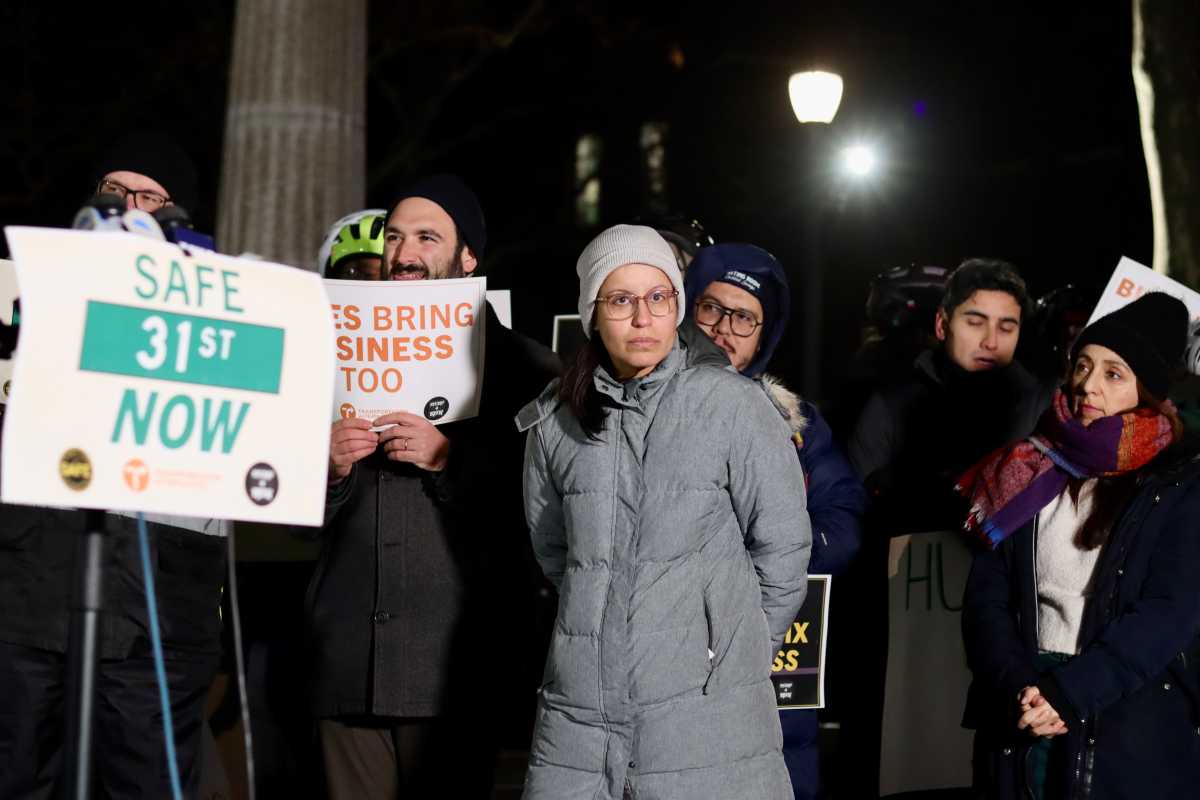 Council Member Tiffany Cabán and transit advocates held an "emergency rally" in Athens Square Park protesting a recent ruling ordering the DOT to halt plans for a protected bike lane on 31st Street. Photo courtesy of Transportation Alternatives.