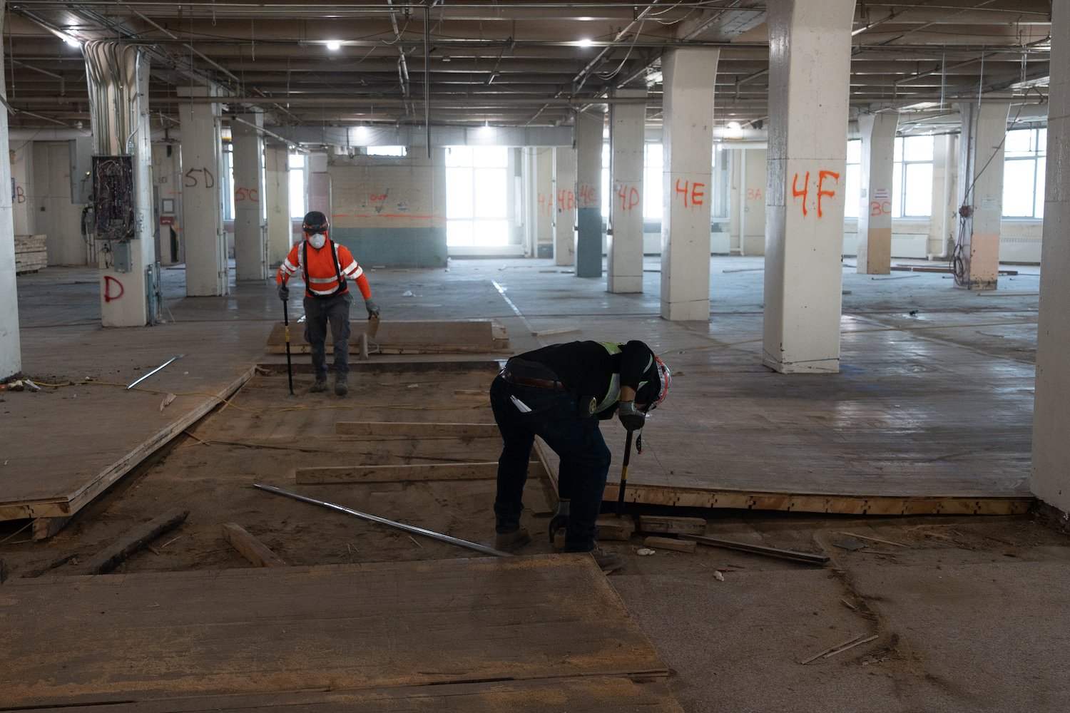 Workers rip up 100-year-old hardwood floors at LaGuardia College's Building C. Photo Courtesy of LaGuardia Community College.