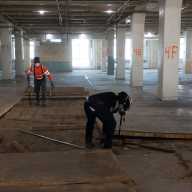 Workers rip up 100-year-old hardwood floors at LaGuardia College's Building C. Photo Courtesy of LaGuardia Community College.