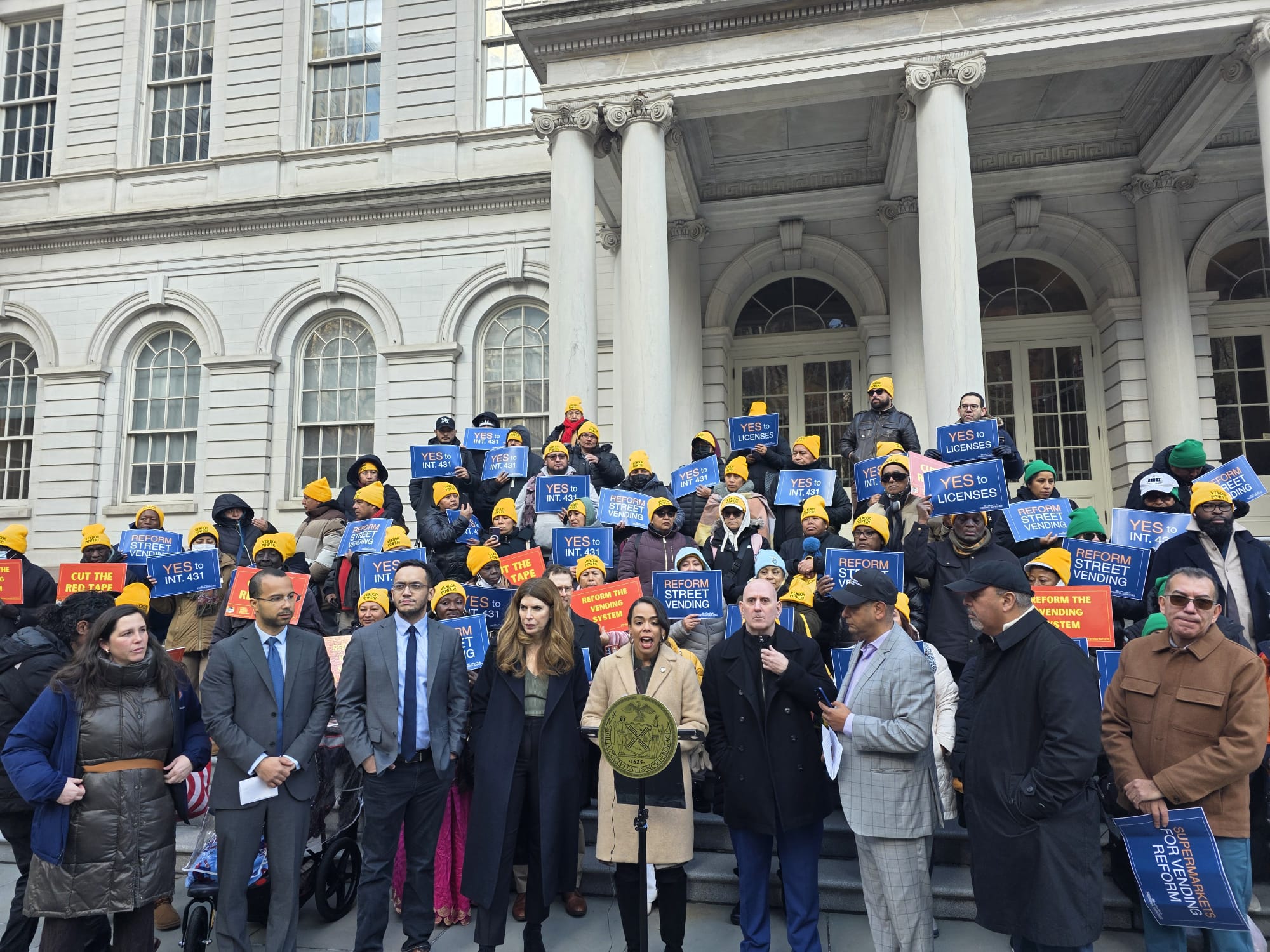 Elected officials and street vendor advocates rally on the steps of City Hall in support of Intro 431A. Photo by Shane O'Brien.