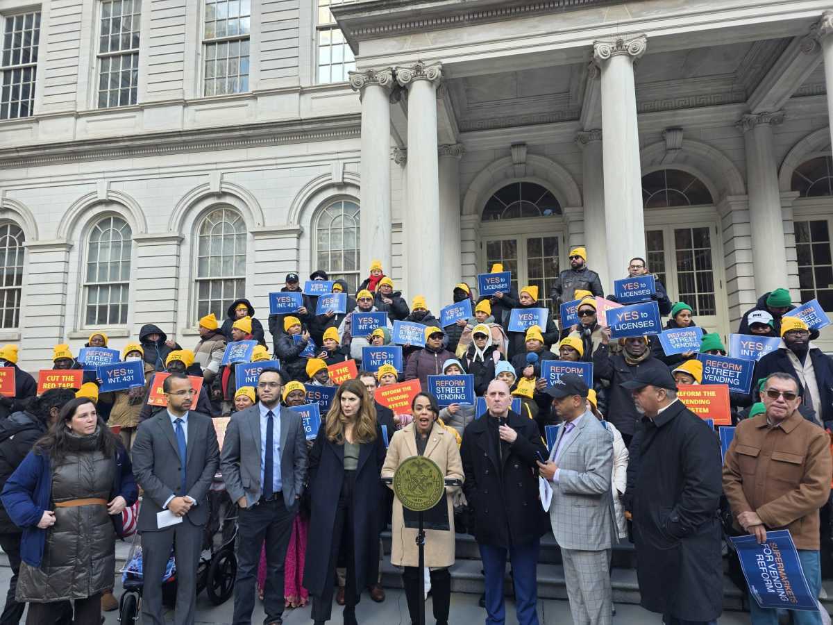 Elected officials and street vendor advocates rally on the steps of City Hall in support of Intro 431A. Photo by Shane O'Brien.
