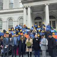 Elected officials and street vendor advocates rally on the steps of City Hall in support of Intro 431A. Photo by Shane O'Brien.