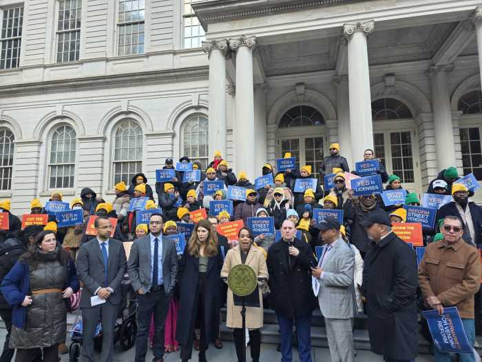Elected officials and street vendor advocates rally on the steps of City Hall in support of Intro 431A. Photo by Shane O'Brien.