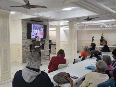 Karen Taylor of Selfhelp speaks to Jackson Heights seniors after the organization conducted a walking audit of the 34th Avenue Open Street. Photo by Shane O'Brien.