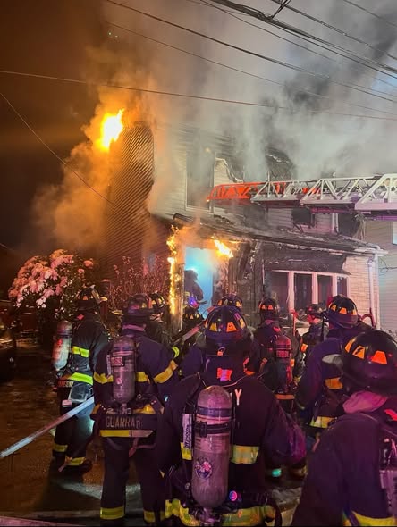 Firefighters battled a two-alarm fire at 70-07 57th Road after the blaze spread to a neighboring home. 