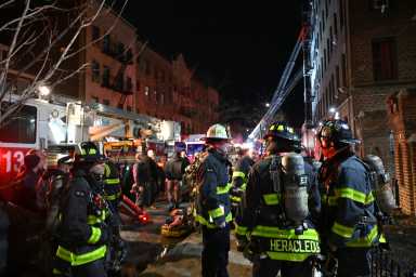 The FDNY battled a 2-alarm fire on the upper floors of an apartment building at 37-52 89th St. in Jackson Heights that displaced 27 adults and four children.