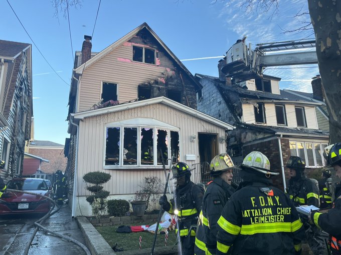 Firefighters battled a three-alarm house fire in Whitestone on Christmas Day that spread to two neighboring homes.