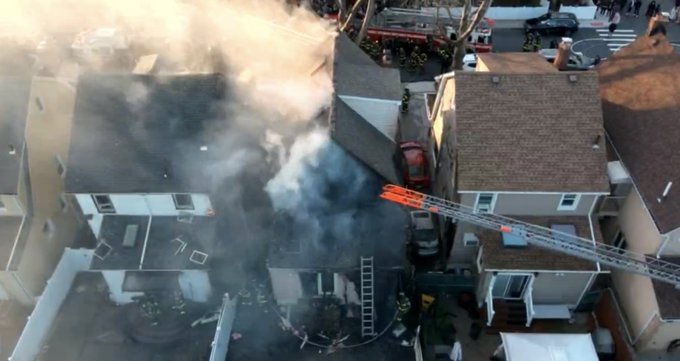 Firefighters battled a three-alarm house fire in Whitestone on Christmas Day that spread to two neighboring homes. 