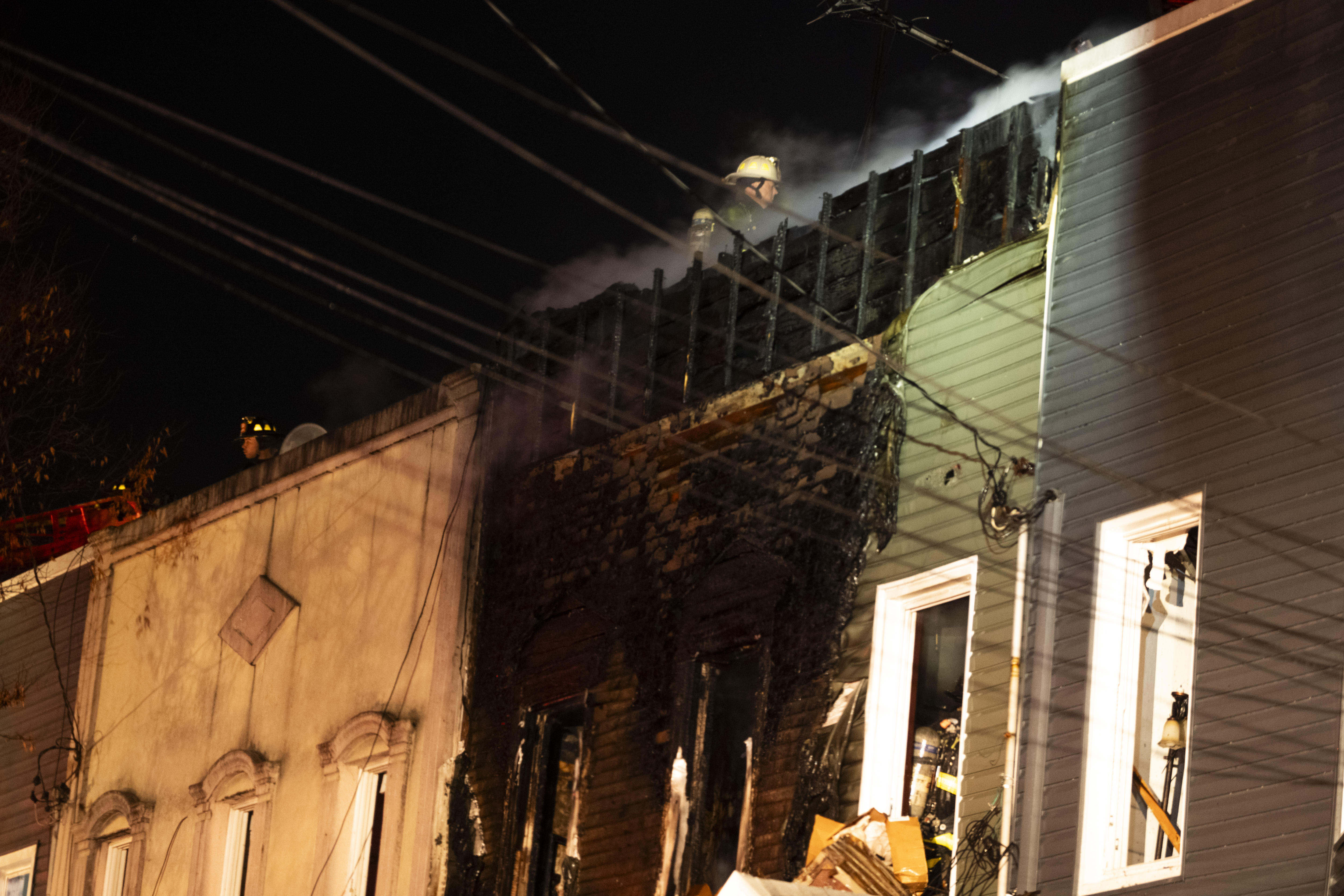Hundreds of firefighters battled a 5-alarm fire that ripped through four adjoining two-family homes in Richmond Hill on Monday, Dec. 1.