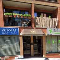 Relax Spa, an alleged brothel at 23-20A Broadway, was shuttered last month after an undercover police investigation determined the presence of prostitution at the premises. Photo via Google Street View.