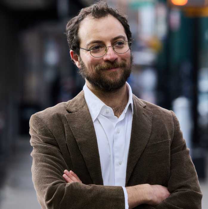 DSA member David Orkin has launched a campaign to primary AM Jenifer Rajkumar in the 38th Assembly District. Photo via David4Queens Instagram.