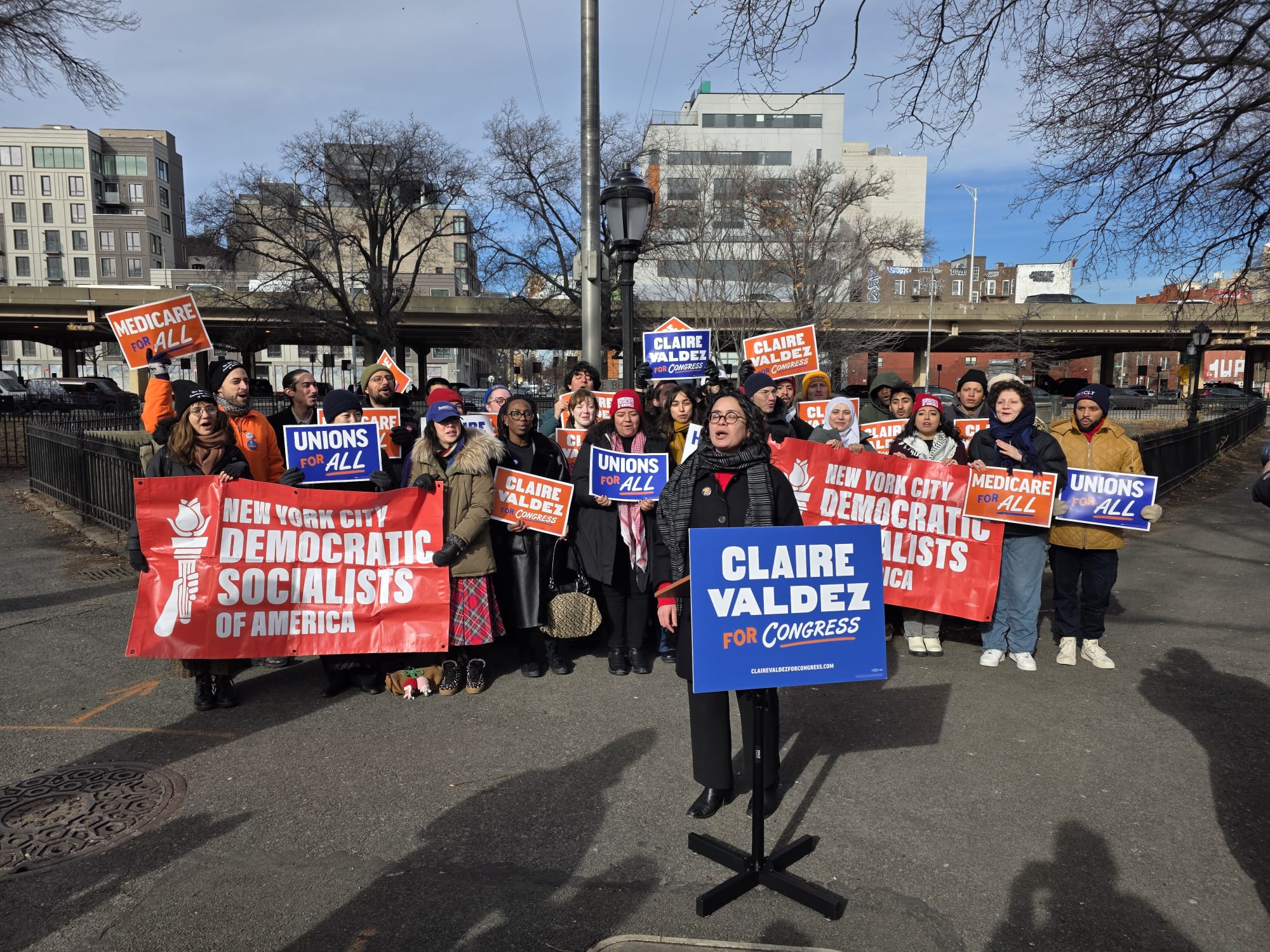 Assembly Member Claire Valdez speaks at a campagin event at Brooklyn's Macri Triangle. Photo by Shane O'Brien.