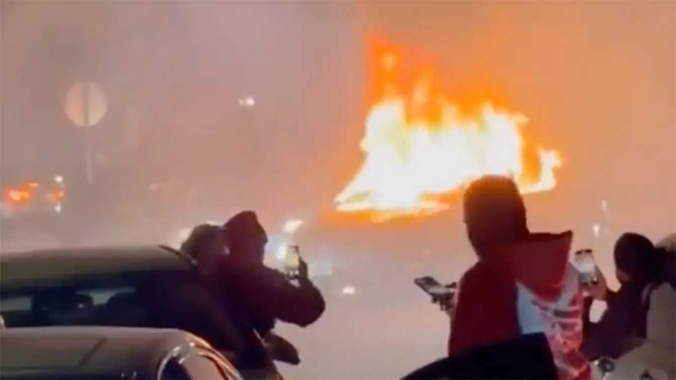 A private security guard tried to intervene by driving his car into the crowd and his vehicle was torched by the mob.