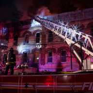The five-alarm fire at 1824 Madison St. in Ridgewood spread to adjoining buildings and hundreds of firefighters battled the blaze for more than five hours.