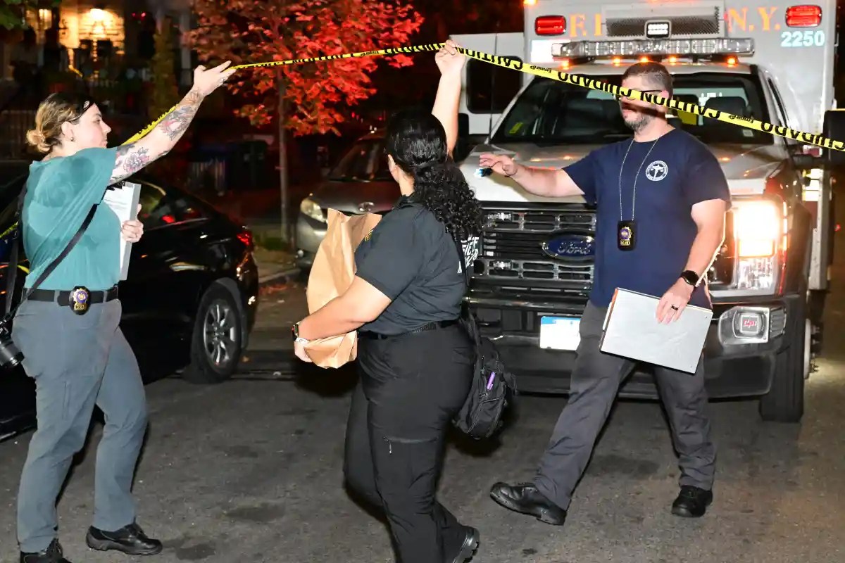 Crime scene investigators from the 115th Precinct gathered evidence from the home at 26-30 96th St. in East Elmhurst following the fatal shooting on the night of Sept. 12, 2025.