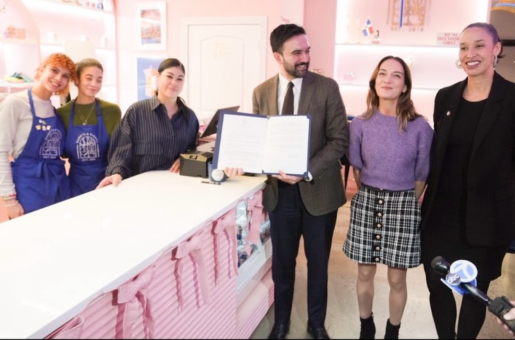 Sen. Julia Salazar and Mayor Zohran Mamdani visit Sweets & Things after the signing of an executive order to aid small businesses avoid fines and fees.