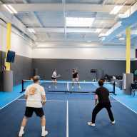 Players take to the court at Gotham Pickleball's original LIC location. Photo via David Goldberg.