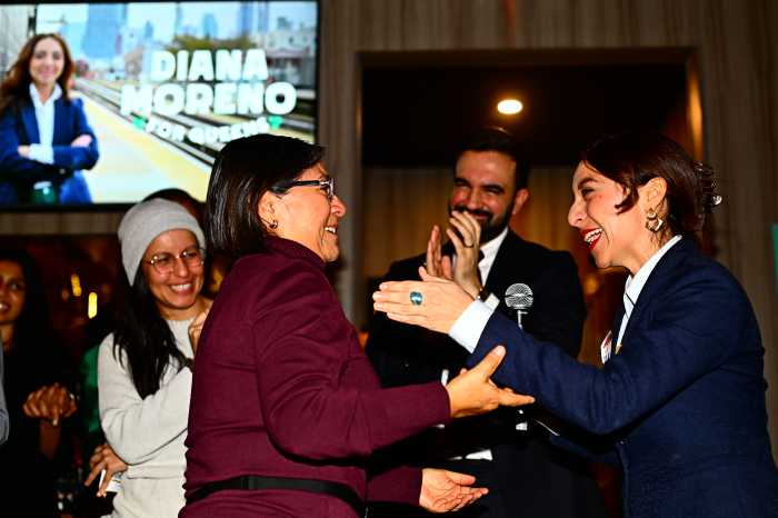 Moreno embraces her mother. Photo by Ramy Mahmoud. 