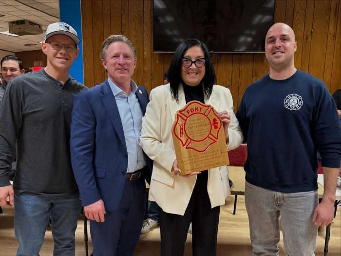 Nick Pugliese, UFOA President Jim Brosi, Council Member Joann Ariola with the plaque from the Lieutenant Eligibles Association, and Paul Porcello during last month's meeting of the FDNY Columbia Association.