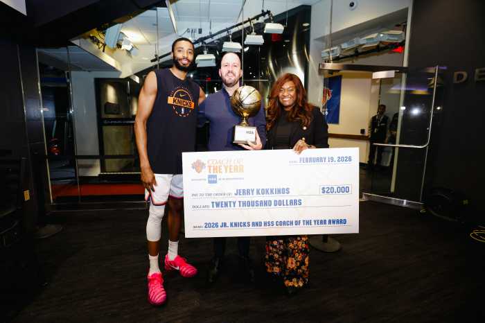 Jerry Kokkinos (center) received a surprise from Knicks forward Mikal Bridges Thursday night. Photo via NY Knicks/Hospital for Special Surgery.