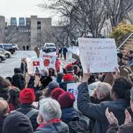 Protesters march at St. John's University after the university announced it would no longer recognize two faculty unions. Photo via SJU-AAUP.