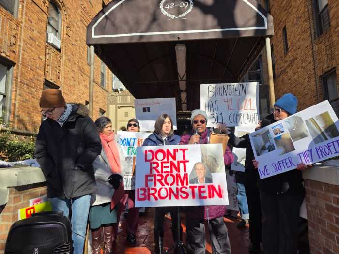 Bronstein tenants Sonu Kumari and Yvette Janis-Allen speak at a rally outside 42-09 47th Ave. to demand repairs in the building. Photo by Shane O'Brien.