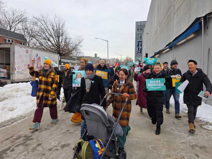Assembly District 36 candidate Diana Moreno makes her way to P.S. 166Q accompanied by supporters. Voting remains ongoing in the Feb. 3 special election. Photo by Shane O'Brien.