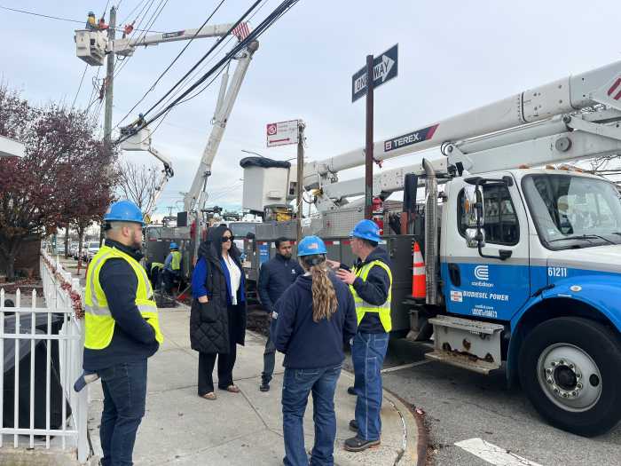 Council Member Joann Ariola with Con Edison repair crews during an earlier power outage in her district.