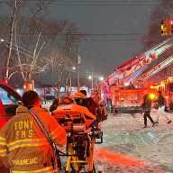 The FDNY fought a 2-alarm fire on the Jamaica Bay waterfront in Rockaway Beach that displaced at least one family, according to the Red Cross.