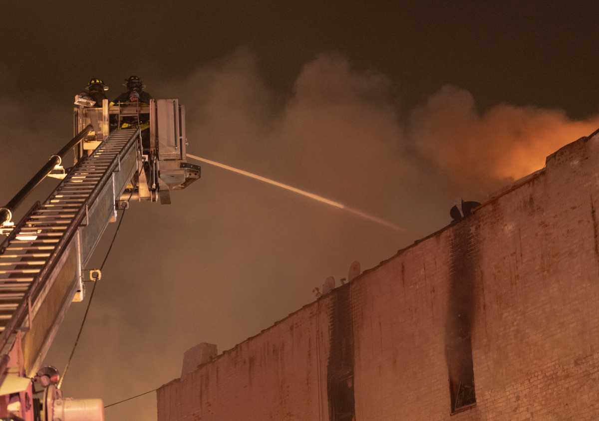 Three firefighters were injured during a two alarm warehouse fire in Flushing on Feb. 3, according to the FDNY.