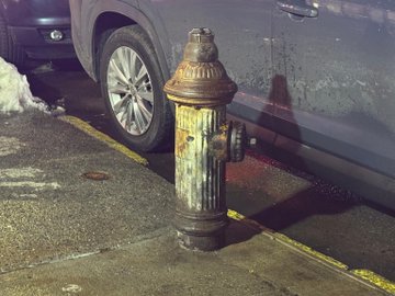 The FDNY response was slowed by an illegally parked vehicle, like this one, blocking a nearby fire hydrant. 