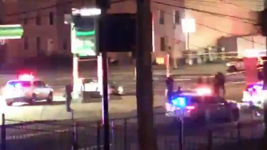 Police from the 104th Precinct at the scene of the crime during the early morning of Feb. 26, 2021. 