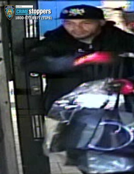 The suspect wore red gloves and was carrying several bags and packages.
