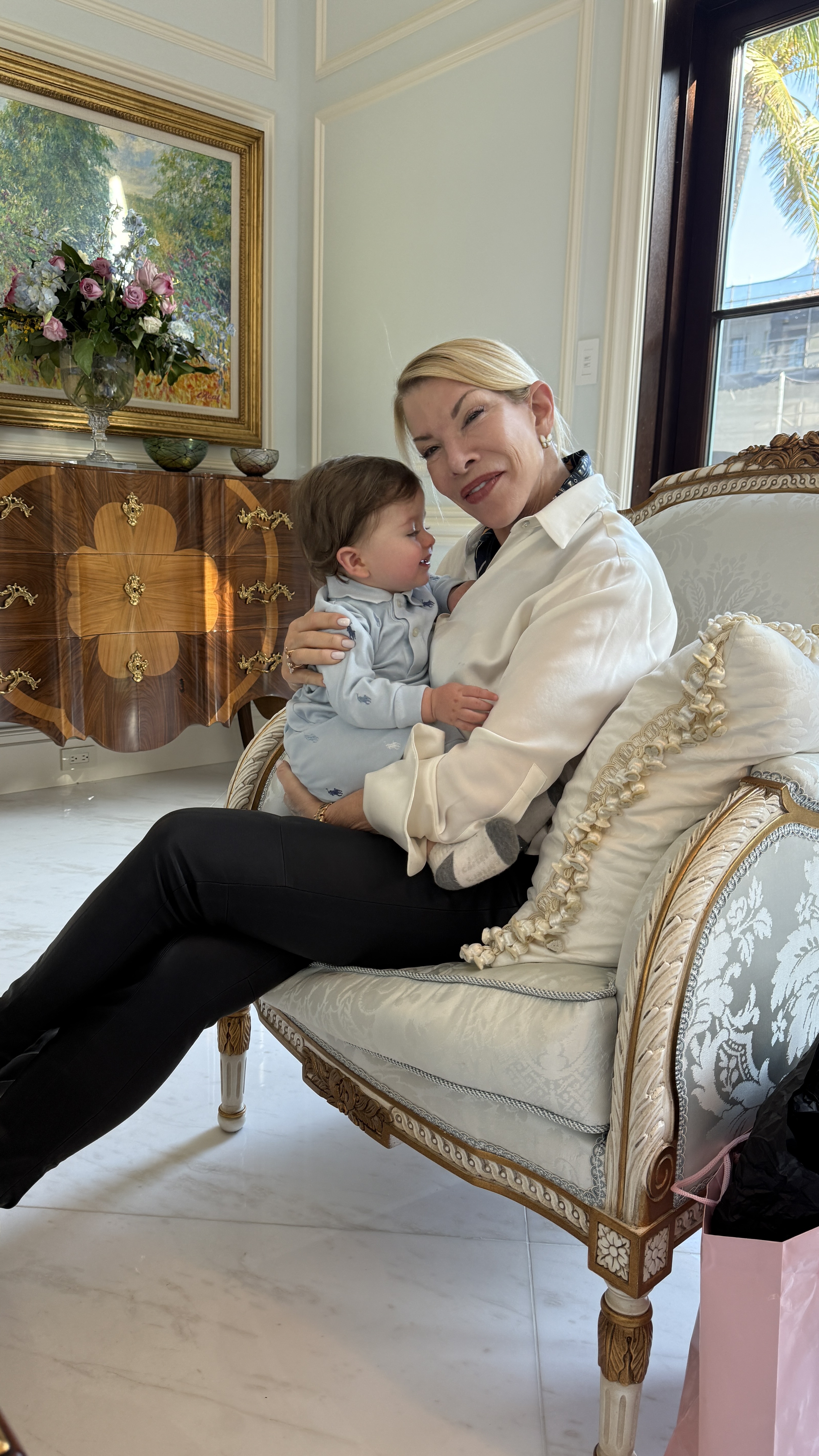 Philanthropist/businesswoman Amanda Schumacher with her grandson 