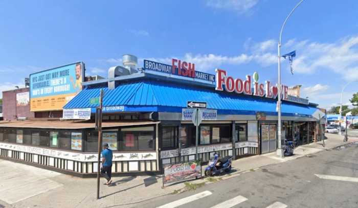 A Woodside Houses man was charged with two counts of assault for slashing a woman across her face after she tried to help another man who had been attacked during a rampage in front of a fish market in Astoria.